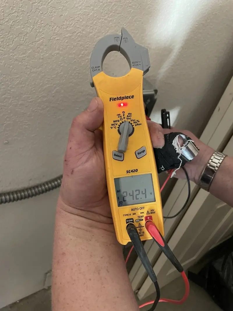 Voltage testing with clamp meter during Ceiling Fan Installation in Mooers